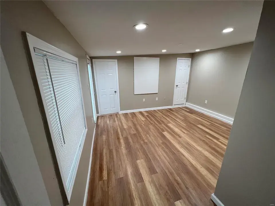 Room before Archer Spaces organization and staging — cluttered and overwhelming