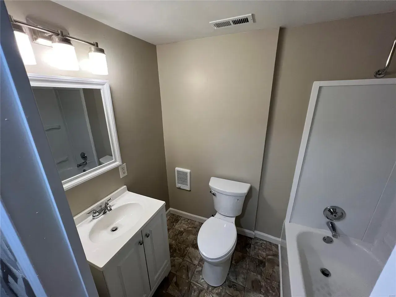 Second room before Archer Spaces staging — disorganized and hard to show